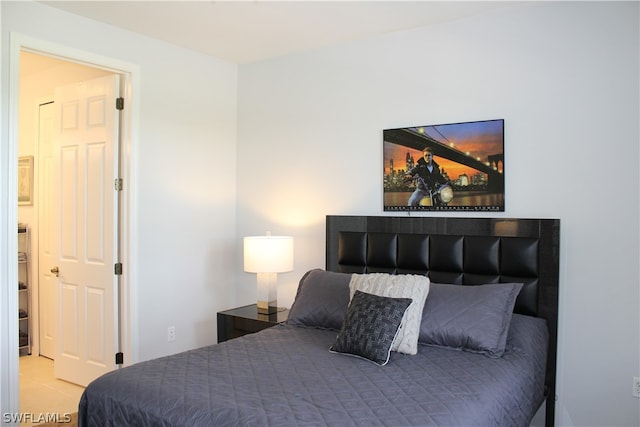 bedroom featuring light carpet