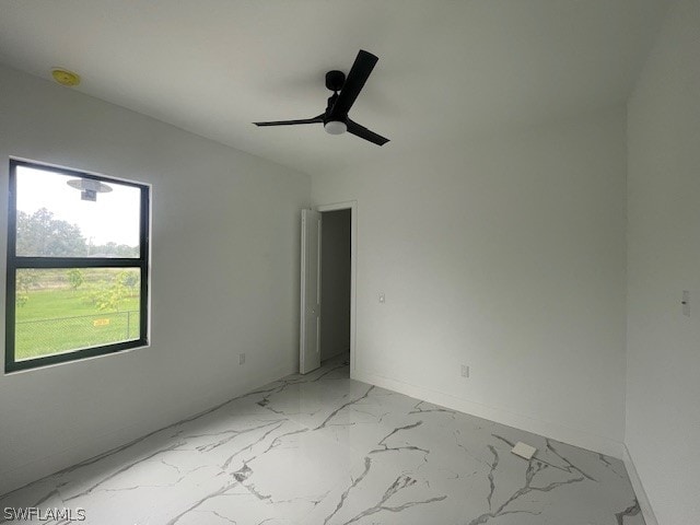 spare room with ceiling fan