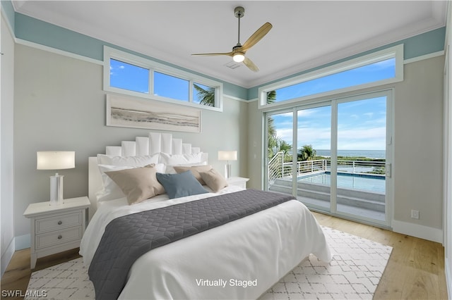 bedroom featuring light wood-type flooring, access to outside, ceiling fan, and ornamental molding