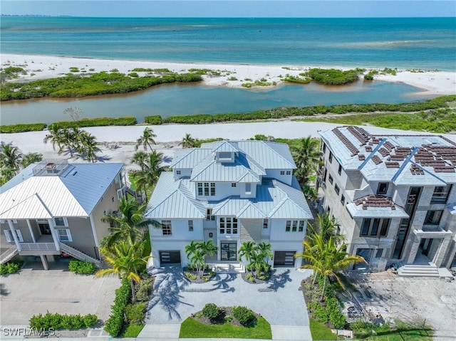 aerial view featuring a view of the beach and a water view