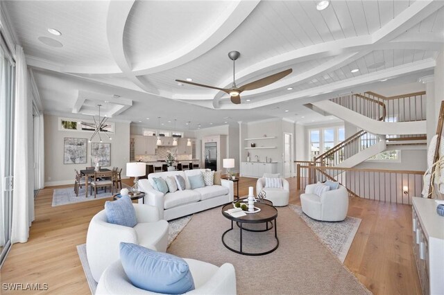 living room with light wood-type flooring and ceiling fan