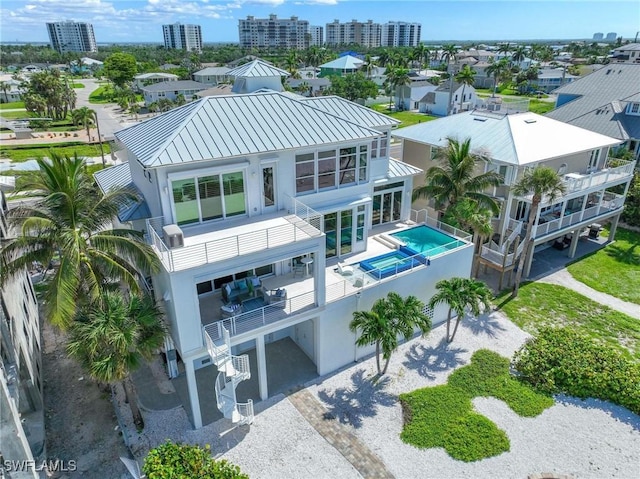 birds eye view of property featuring a city view