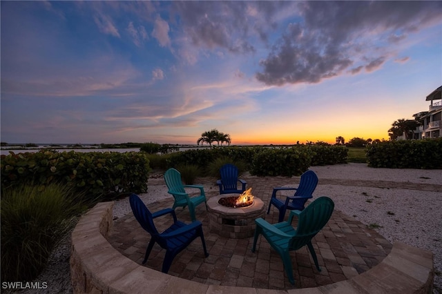 patio terrace at dusk with a fire pit