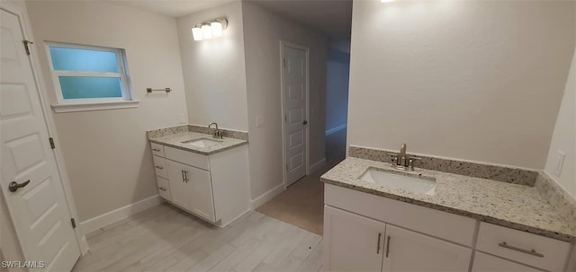 bathroom with vanity and hardwood / wood-style flooring