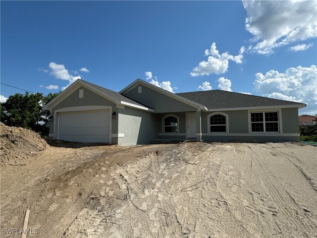 ranch-style home featuring a garage