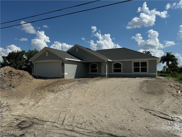 single story home with a garage