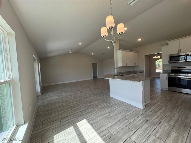 kitchen with decorative light fixtures, a chandelier, kitchen peninsula, stainless steel appliances, and white cabinets