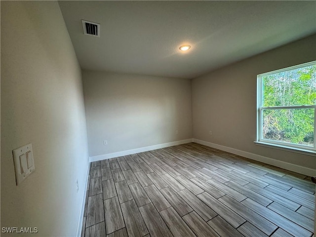 empty room with light hardwood / wood-style flooring