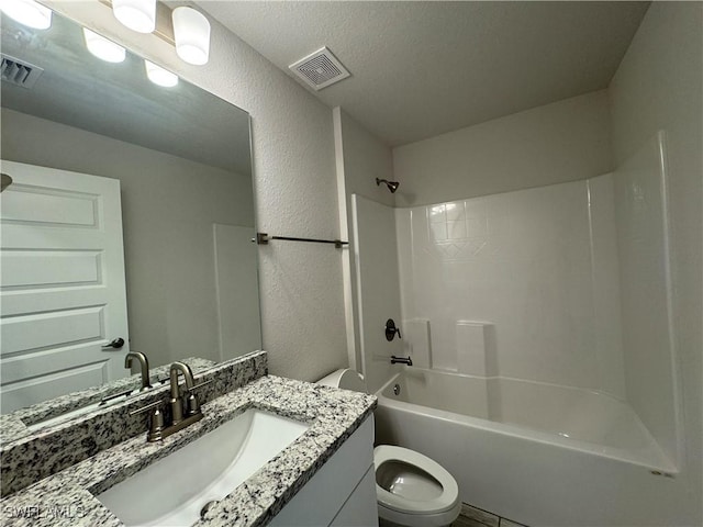 full bathroom featuring shower / tub combination, vanity, and toilet