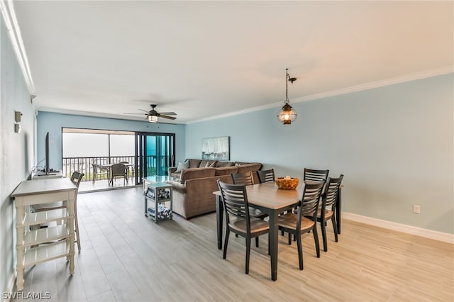 dining area with ornamental molding, ceiling fan, and light hardwood / wood-style flooring