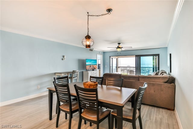 dining room with crown molding, ceiling fan, and light hardwood / wood-style flooring