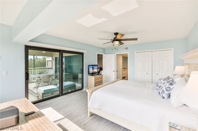 bedroom with ceiling fan, a closet, access to outside, and light wood-type flooring