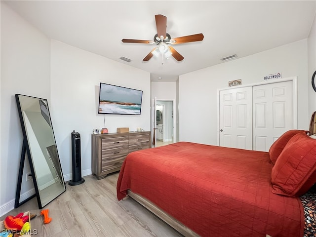 bedroom with a closet, ceiling fan, and light hardwood / wood-style flooring