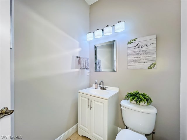 bathroom featuring toilet and vanity