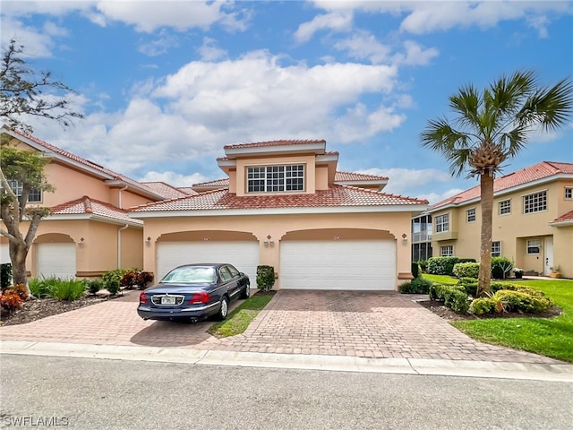 mediterranean / spanish-style home featuring a garage