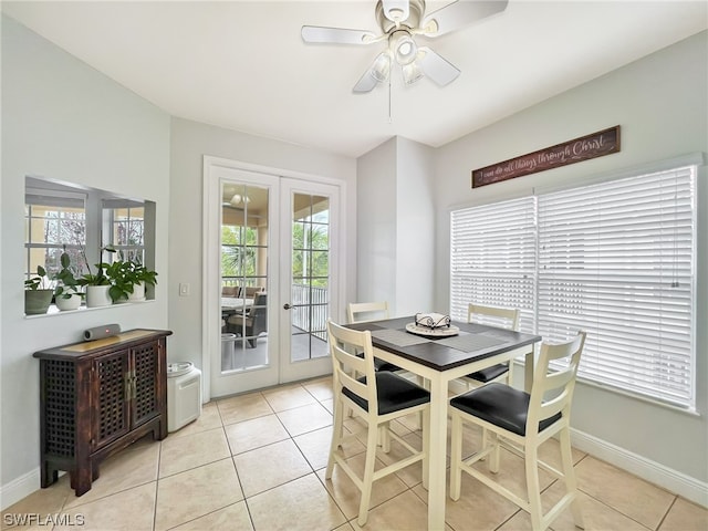 tiled dining area with french doors and ceiling fan