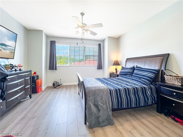 bedroom featuring light hardwood / wood-style floors and ceiling fan