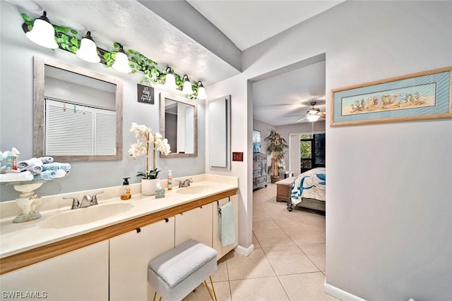 bathroom featuring tile patterned floors, vanity, and ceiling fan