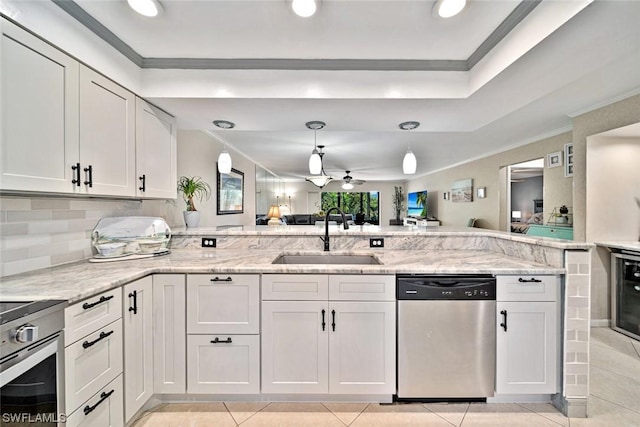 kitchen with white cabinetry, dishwasher, ceiling fan, and sink