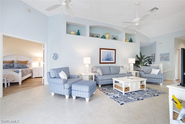 living room with high vaulted ceiling, ceiling fan, and light tile floors