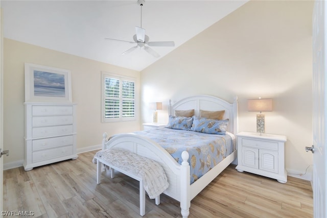 bedroom featuring high vaulted ceiling, light hardwood / wood-style floors, and ceiling fan