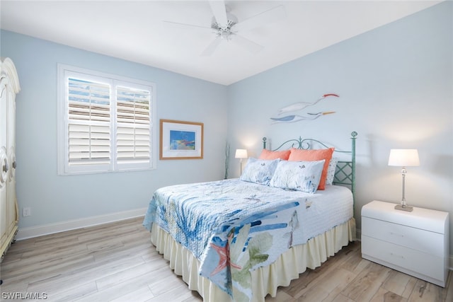 bedroom featuring light hardwood / wood-style floors and ceiling fan