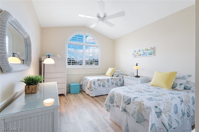 bedroom with vaulted ceiling, light hardwood / wood-style floors, and ceiling fan