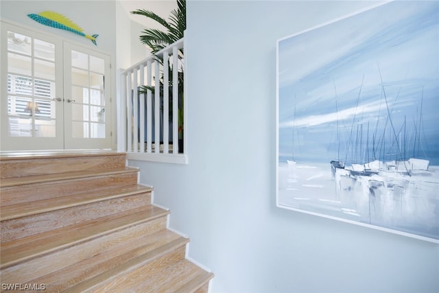 staircase with french doors