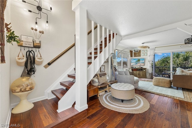 stairway featuring hardwood / wood-style floors