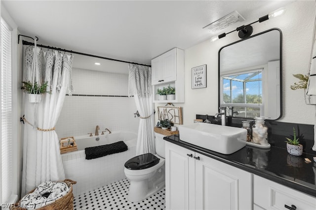 full bathroom featuring tile patterned floors, vanity, toilet, and shower / bathtub combination with curtain