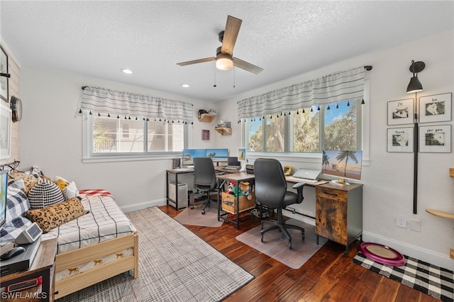 office space with ceiling fan, hardwood / wood-style floors, and a textured ceiling