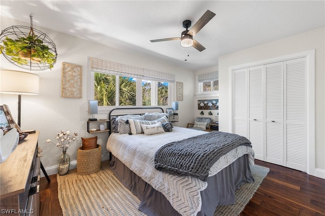 bedroom with ceiling fan, dark hardwood / wood-style flooring, and a closet