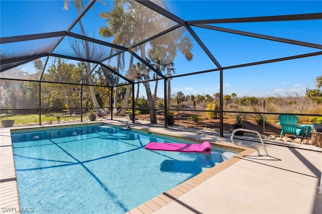 view of pool featuring a patio area and a lanai