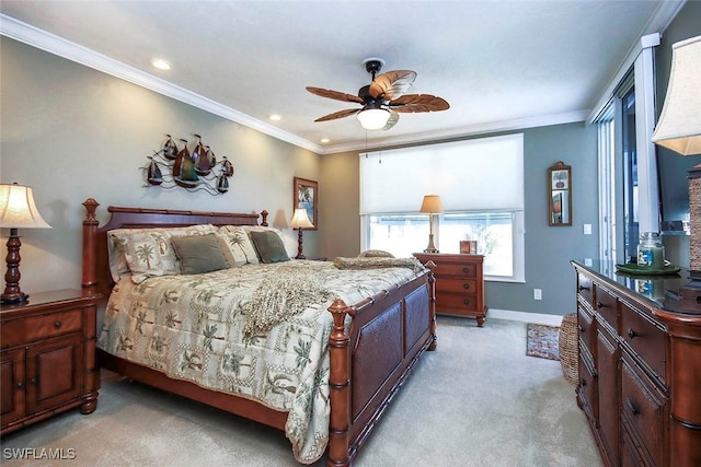 carpeted bedroom with ceiling fan and ornamental molding