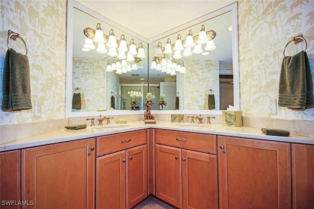 bathroom featuring vanity, a shower with door, and crown molding