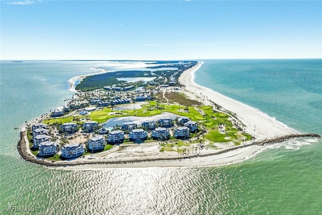 birds eye view of property featuring a water view and a view of the beach