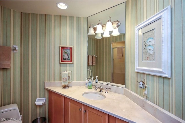 bathroom with vanity and toilet