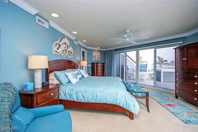 carpeted bedroom featuring ceiling fan and crown molding