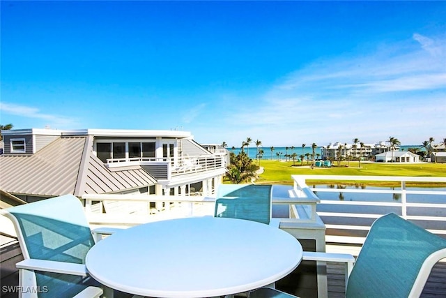 balcony featuring a water view