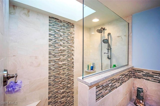 bathroom with tiled shower