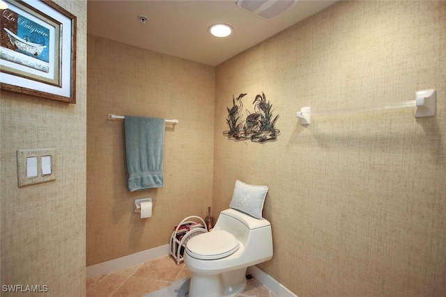 bathroom featuring toilet and tile patterned floors