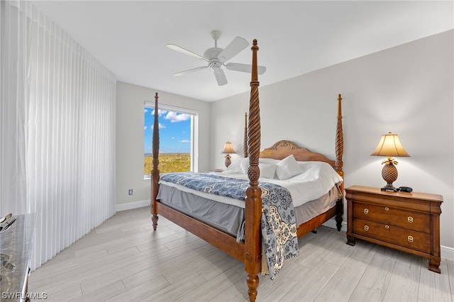 bedroom featuring light hardwood / wood-style floors and ceiling fan