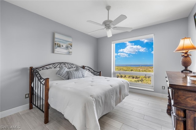 bedroom featuring light hardwood / wood-style flooring and ceiling fan