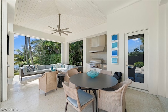 sunroom / solarium featuring ceiling fan and wood ceiling