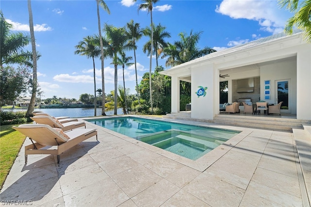 view of swimming pool with an in ground hot tub and a patio area