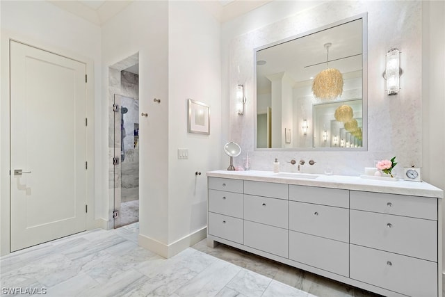 bathroom with vanity, a shower with door, and tile flooring