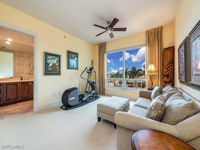 carpeted living room featuring ceiling fan