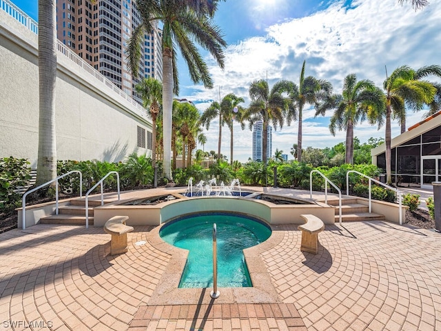 view of pool featuring a hot tub