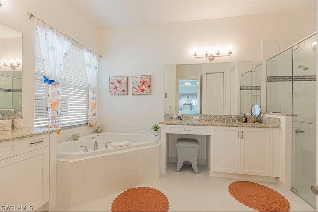 bathroom featuring vanity, a wealth of natural light, separate shower and tub, and tile patterned floors