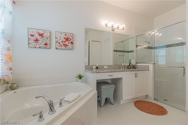 bathroom with plus walk in shower, tile patterned flooring, and vanity